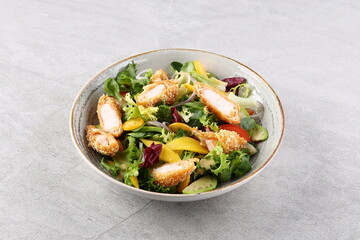 Salad with shrimps in panko breadcrumbs, top selling for restaurant and food delivery