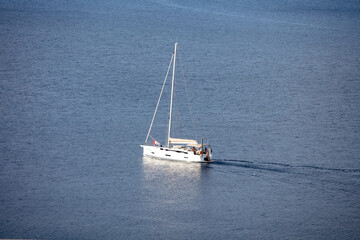 Obraz premium A Sailboat off the coast of Koukounaris Skiathos Island Greece