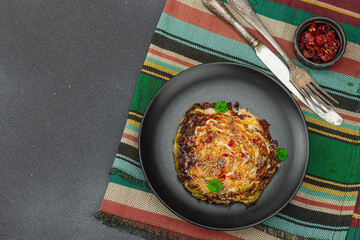 Homemade vegan cabbage steaks with herbs and spices. Healthy food ready to eat on a serving plate