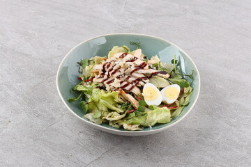 Salad with chicken breast and unagi sauce for the restaurant