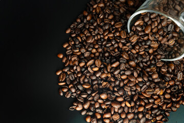 Top View of Coffee Beans Spilling from Glass