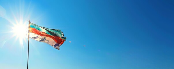 Bulgaria flag against a clear, blue sky