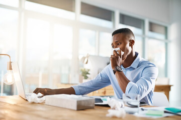 Man, working and sick in office with tissue for healthcare, flu infection or FLiRT Covid. Male person, company or virus with nose cloth for bacteria, employee with allergy on laptop for medical