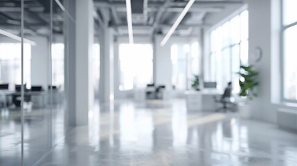 Fototapeta premium Blurry view of a sleek white office interior, open space design with natural light