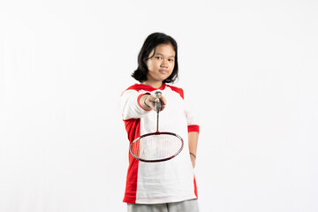 Young Asian woman wearing Indonesian clothing is holding a racket and playing badminton. isolated white background