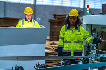 male and female technician engineers checking the process on Heavy machine. mechanical engineering team production. Industry manufacturing. Worker holding tablet and folde. High technology production.