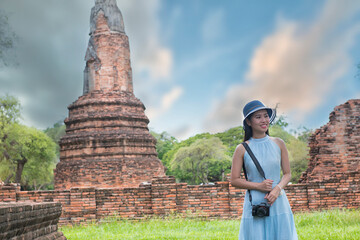 temple si sanphet city. Beautiful woman  is travel on holiday in Ayutthaya, Thailand. People walking  on Ayutthaya Historical Park, Thailand.
