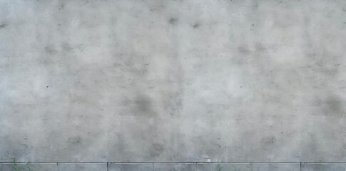 concrete sidewalk texture with green grass and a gray wall in the background