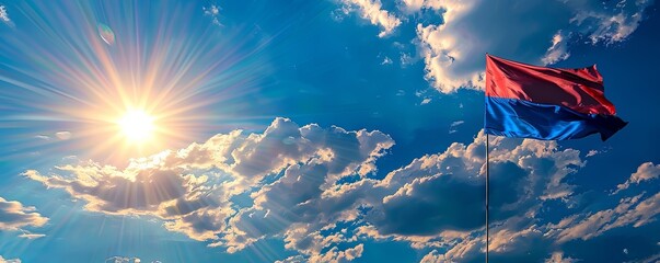 Cambodia flag waving against a bright, blue sky