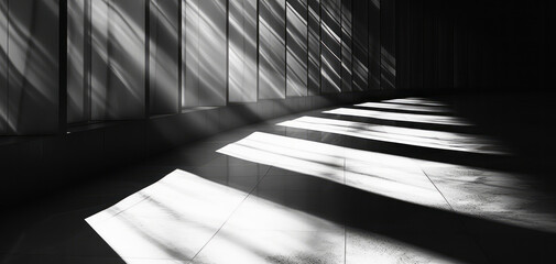In a black and white photo, light shines through thin windows, displaying simple and elegant compositions.