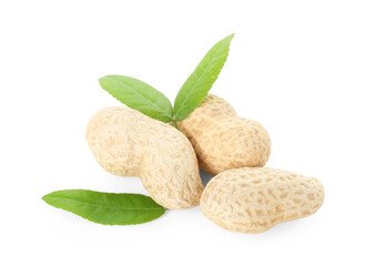 Fresh unpeeled peanuts and green leaves isolated on white