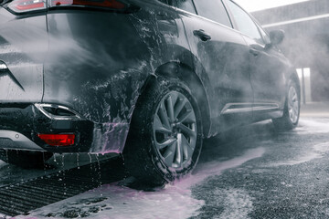 Car washing. Cleaning Car Using High Pressure Water