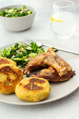 Chickpea cutlets with mixed salad with cucumbers and radishes, baked farm chicken legs, a delicious hearty lunch or dinner