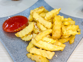 french fries or homemade french fries with tomato sauce. concept illustration of food that is not good for health