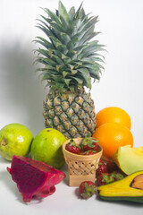 fruits on white background. Strawberry, Orange,  melon, pineapple,guava. avocado & dragon fruit