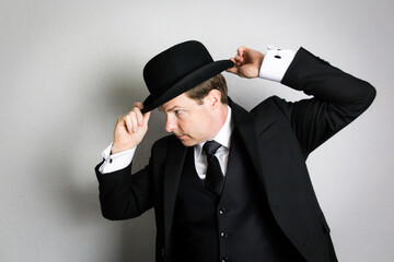 Portrait of Classic English Gentleman in Suit and Bowler Hat. Vintage Style and Retro Fashion.