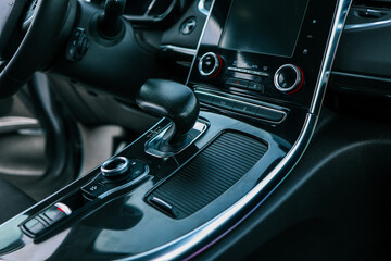 automatic transmission shift selector in the car interior. Closeup a manual shift of modern car gear shifter