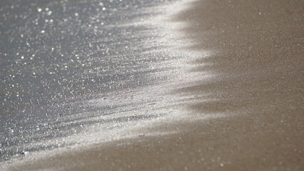 Closeup von Sand und Meer
