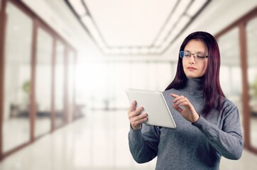 Smiling professional business woman hold digital tablet