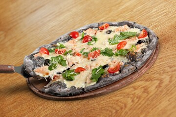 Fresh tasty pizza dish on the desk