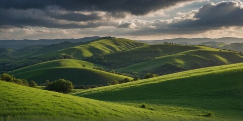 Majestic view of rolling hills under a sunset sky with warm lighting accentuating the landscape shapes