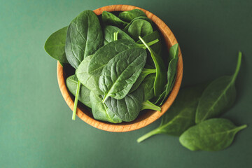 Spinach leaf on a green background, close-up