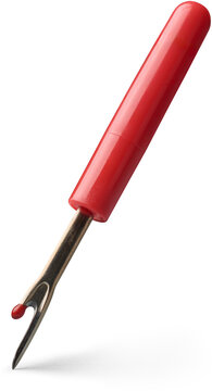 seam ripper or sewing thread remover isolated white background, small tool used cutting and removing stitches with sharp point, curved blade and red handle