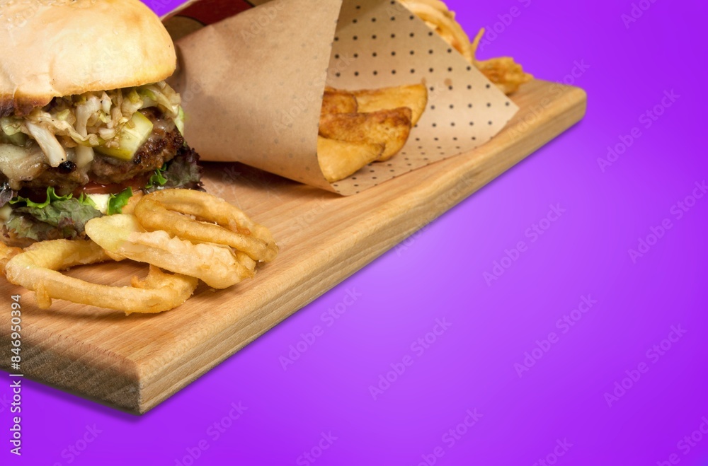 Wall mural tasty fresh hot burger on a wooden board