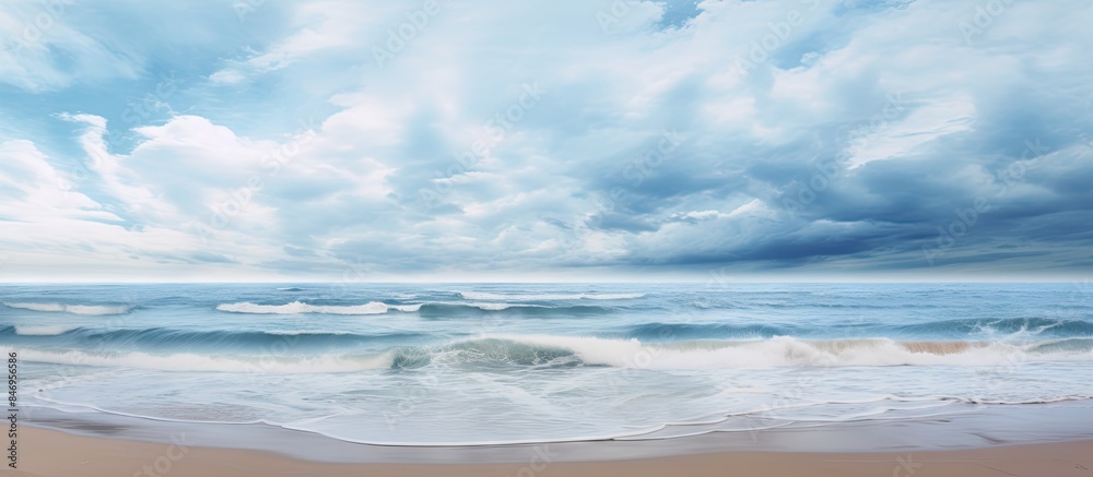 Poster Dark clouds gather over the turbulent ocean with crashing waves on the sandy beach. with copy space image. Place for adding text or design