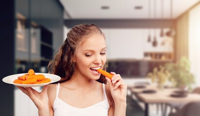 Young happy woman eating tasty food