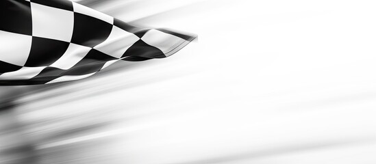 A dynamic close-up of a checkered flag waving vigorously in the wind, symbolizing victory and speed. with copy space image. Place for adding text or design