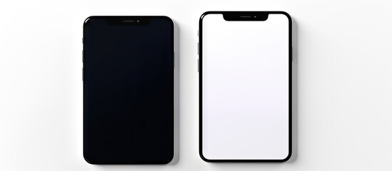 Pair of smartphones positioned side by side on a plain white tabletop. with copy space image. Place for adding text or design