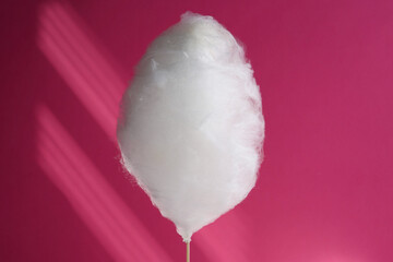 One sweet cotton candy on pink background