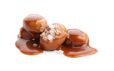 Yummy candies with caramel sauce and sea salt isolated on white