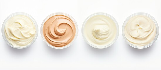 Three bowls containing differently colored creams set on a white surface for sampling purposes. with copy space image. Place for adding text or design