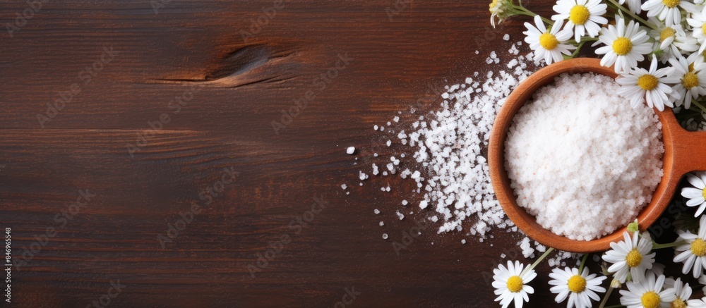 Fototapete salt and fresh flowers arranged in a bowl placed on a rustic wooden table. with copy space image. pl