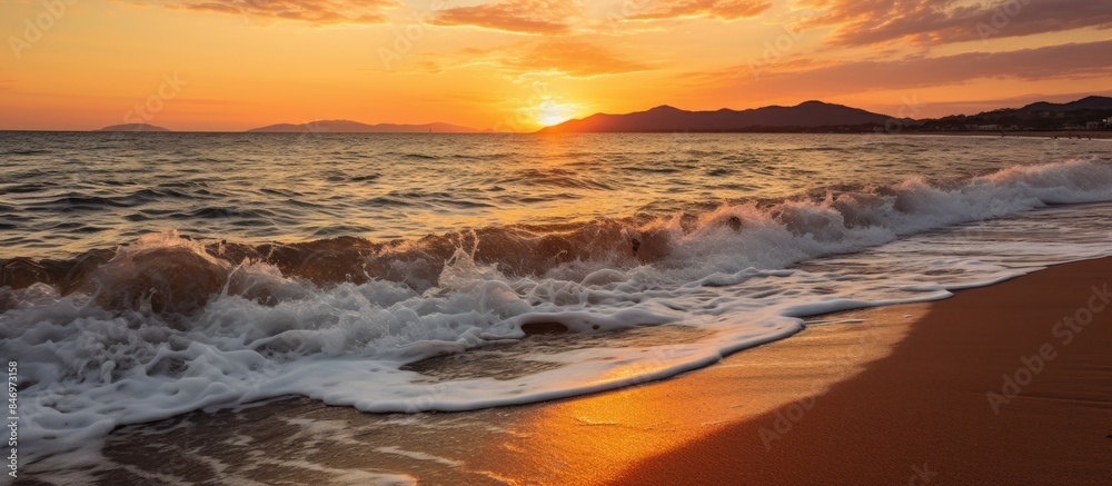 Aufkleber The sun setting over the sea, casting a warm glow over the waves crashing onto the sandy beach. with copy space image. Place for adding text or design