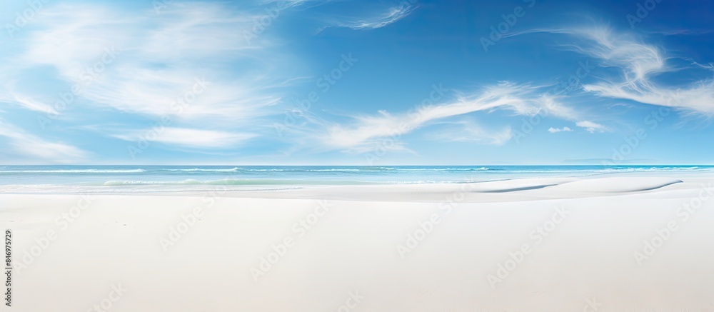 Poster Surfer on a surfboard riding the waves at a sunny beach with clear blue sky in the background. with copy space image. Place for adding text or design