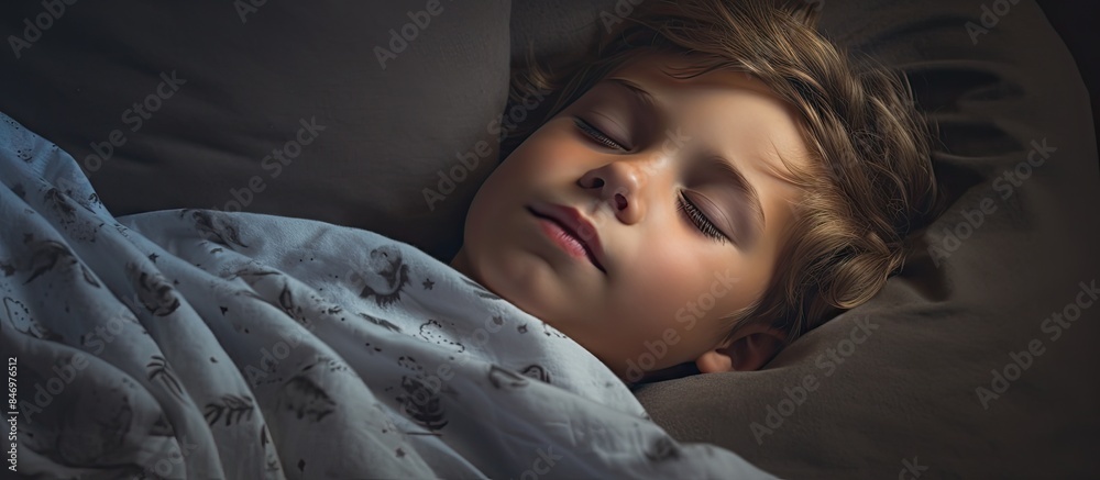 Poster young child peacefully sleeping in a comfortable bed with a cozy blanket. with copy space image. pla