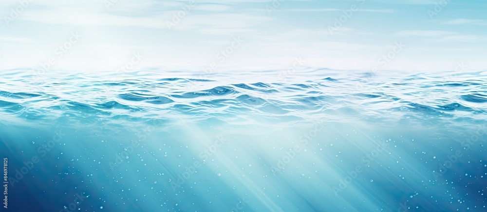 Poster Close-up view of a serene blue ocean with sunlight rays and gentle water ripples creating a tranquil scene. with copy space image. Place for adding text or design