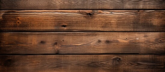 Fototapeta premium Weathered wooden background with a multitude of aged planks, showcasing natural texture and rustic charm. with copy space image. Place for adding text or design