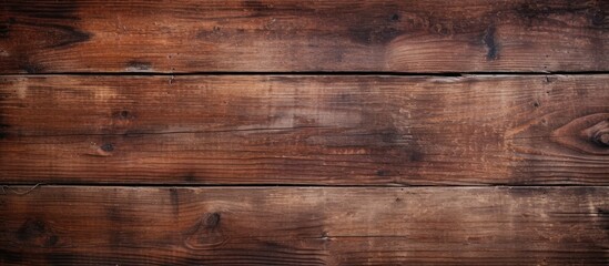 Weathered wood surface with a rustic brown stain, showing an aged and uneven texture pattern in the background. with copy space image. Place for adding text or design