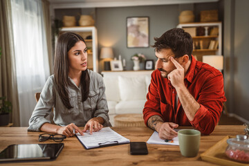 woman financial adviser explain the insurance policy to the men client