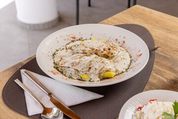 Chicken breasts served with gnocchi in the restaurant