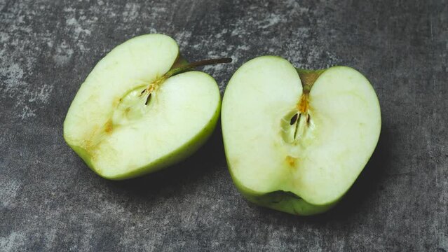 Time lapse of green apple cut into half and oxidized