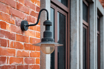 Retro style street lamp on brick wall