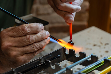 Murano Glassblowing Artisan in Venice, Traditional Handmade Craftsmanship, Glass Working Techniques, Creative Process in Murano Italian Island Workshop, Flame and Heat Manufacturing Skillful Craftsman