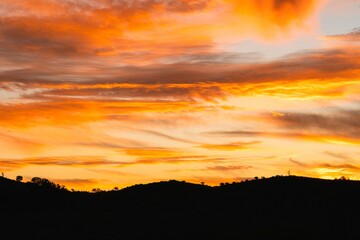 Stunning sunset over a silhouette of hills in Sunset Flinders Ranger National Park