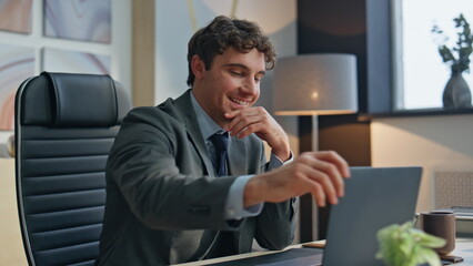 Relaxed businessman working computer closing laptop at office closeup. Man break