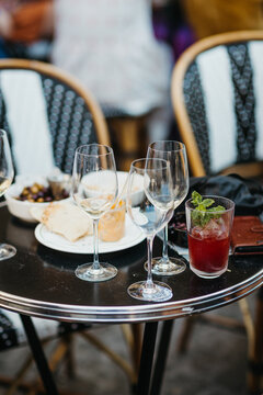 bistro table with drinks and appetizers outdoors